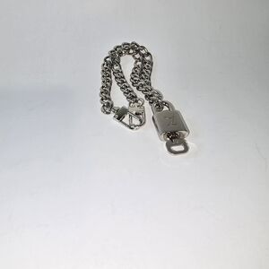 Silver unbranded chain with authentic silver LV lock and key